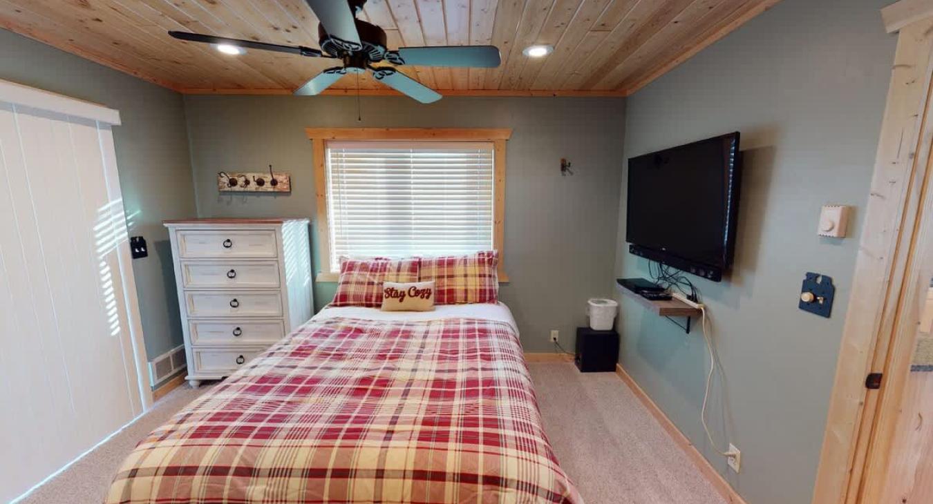 Main level bedroom #1 with a Queen size bed.