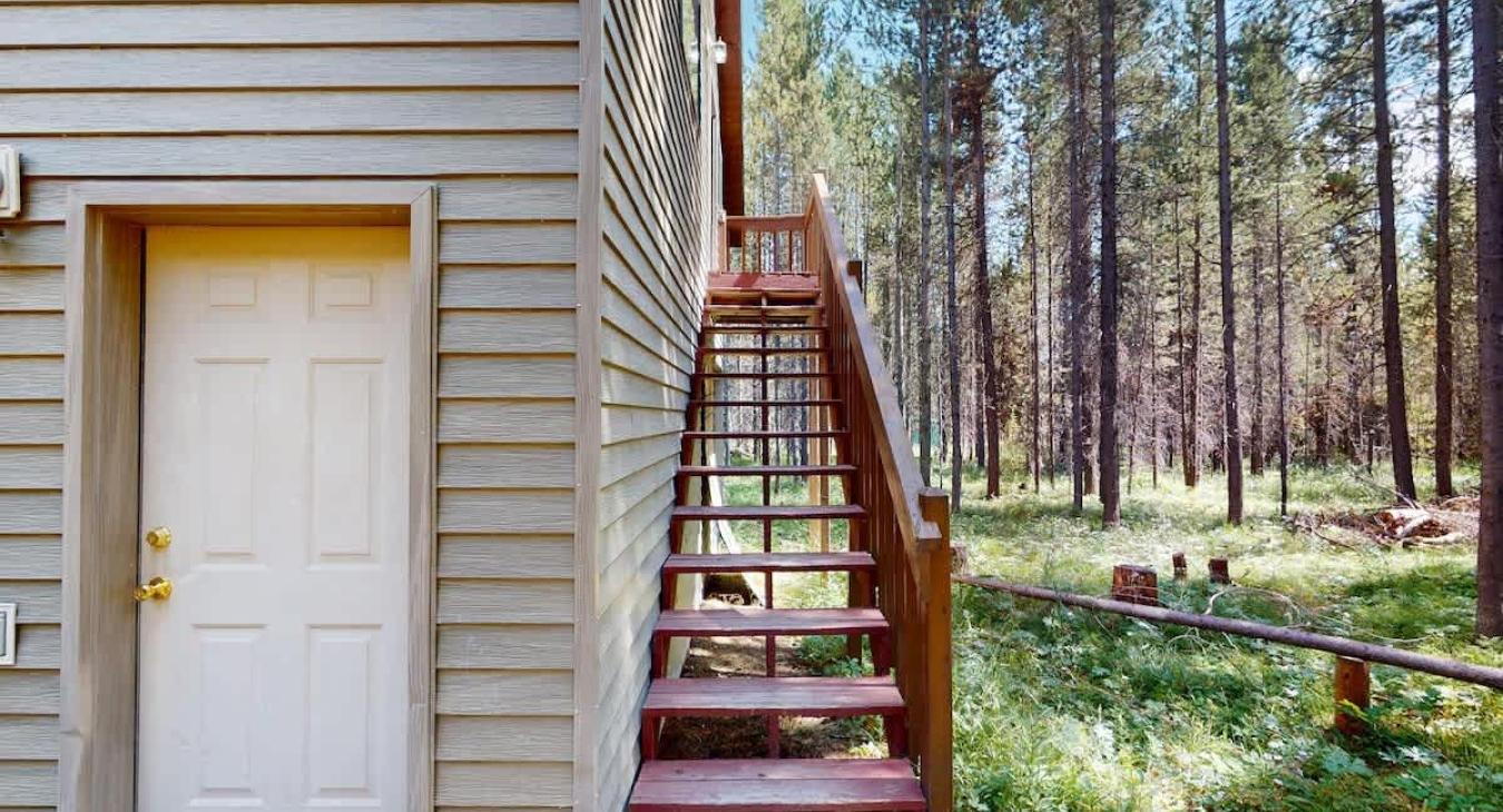 Garage with stairs to the upstairs garage apartment.