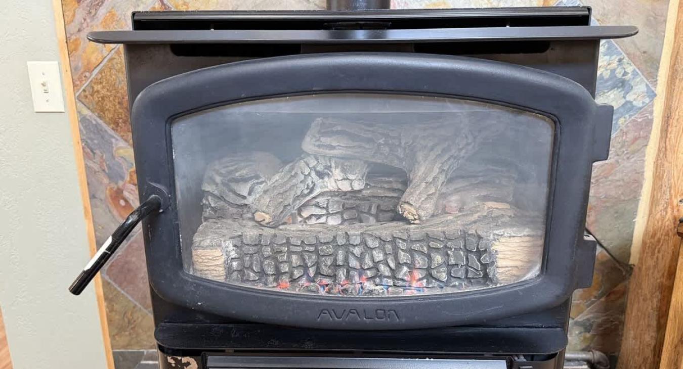 Fireplace located in the living room, make sure to bring your own wood.