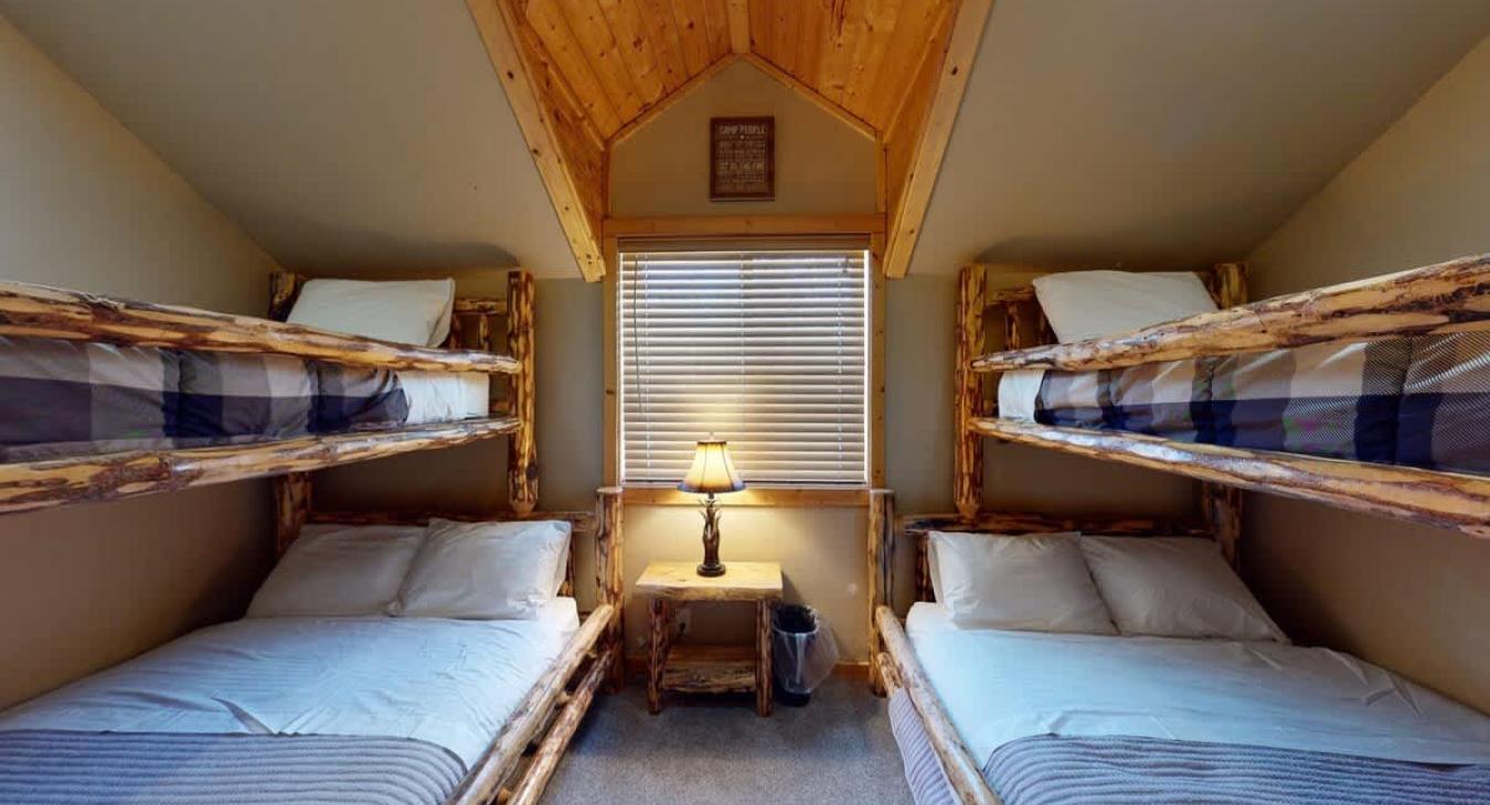 Two sets of bunk beds with 2 twin beds and 2 double beds.