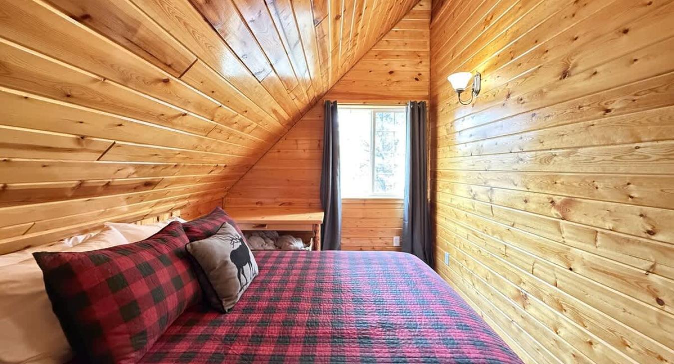 Bedroom upstairs with queen bed to sleep 2 people.