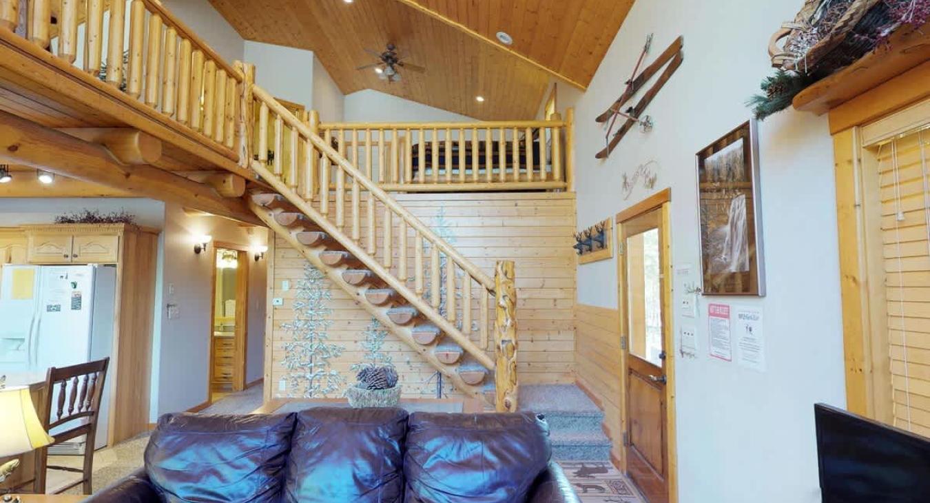 Access to the loft, upstairs bedroom, and bathroom are accessible through the stairs pictured here.