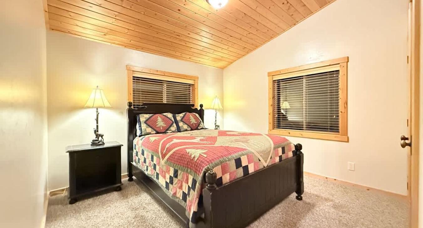 Bedroom #6 located upstairs with a Queen size bed.