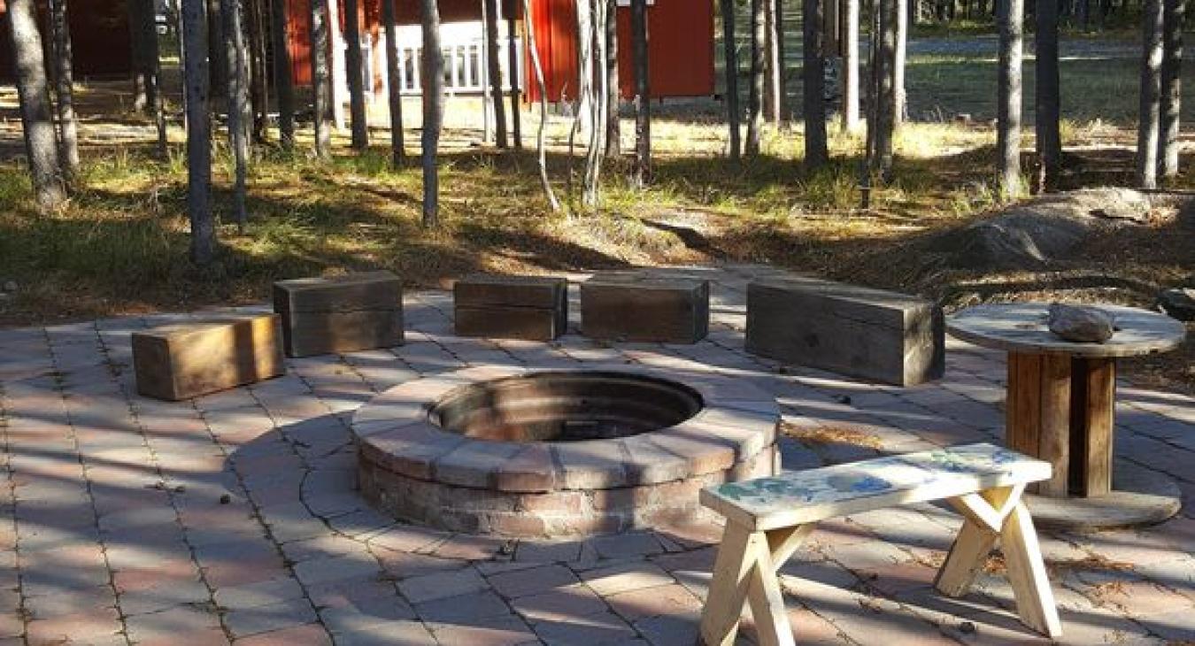 Fire pit located outside perfect for roasting s'mores. Make sure to bring your own wood.