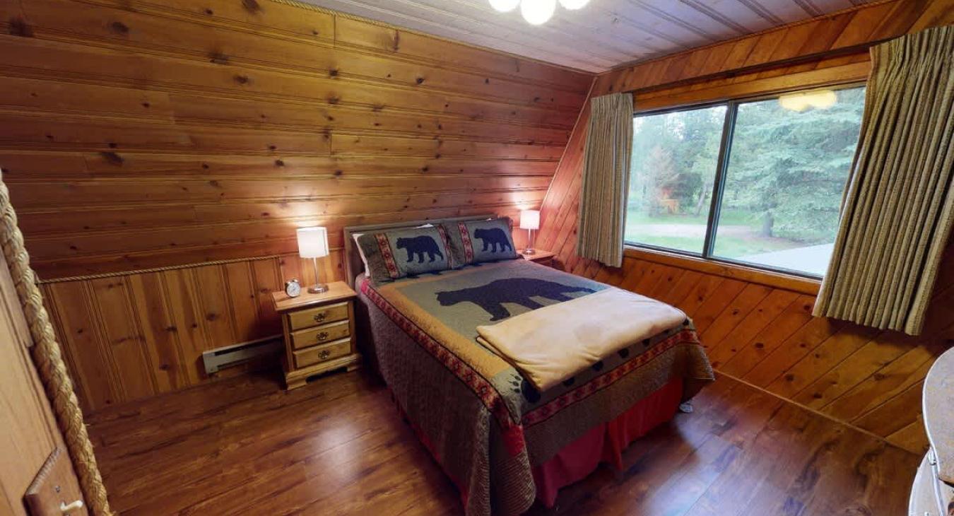 Bedroom #4 located upstairs with a Queen and a single bed.