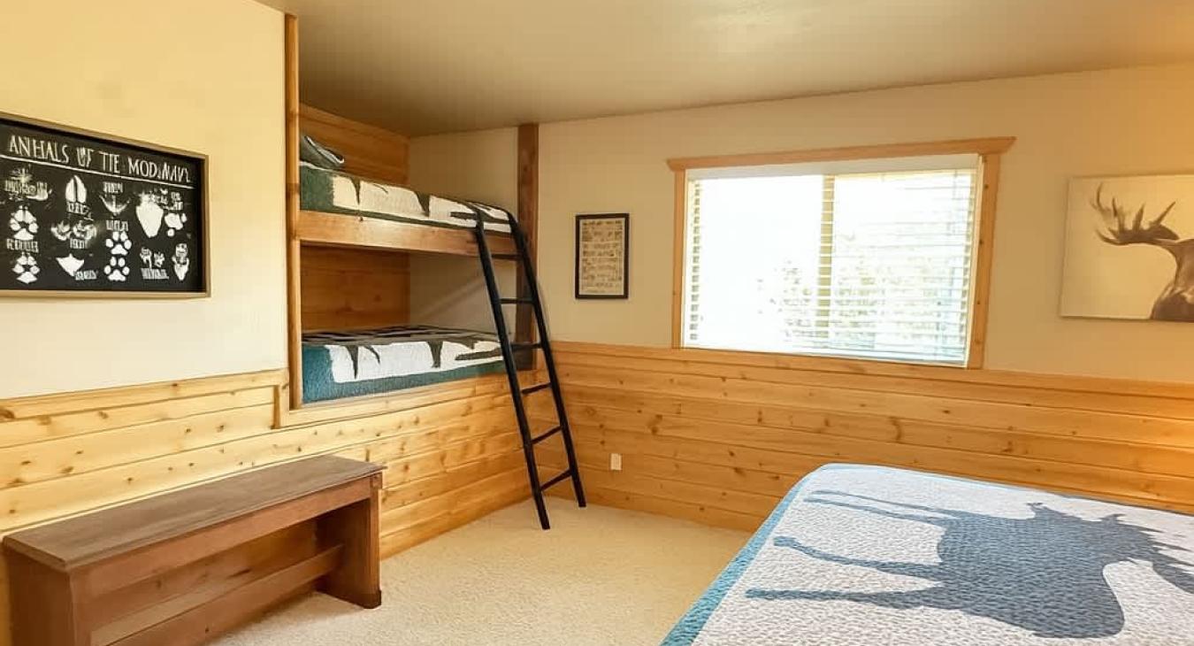 This room is equipped with a queen bed and a built in bunk bed with 2 twin beds.