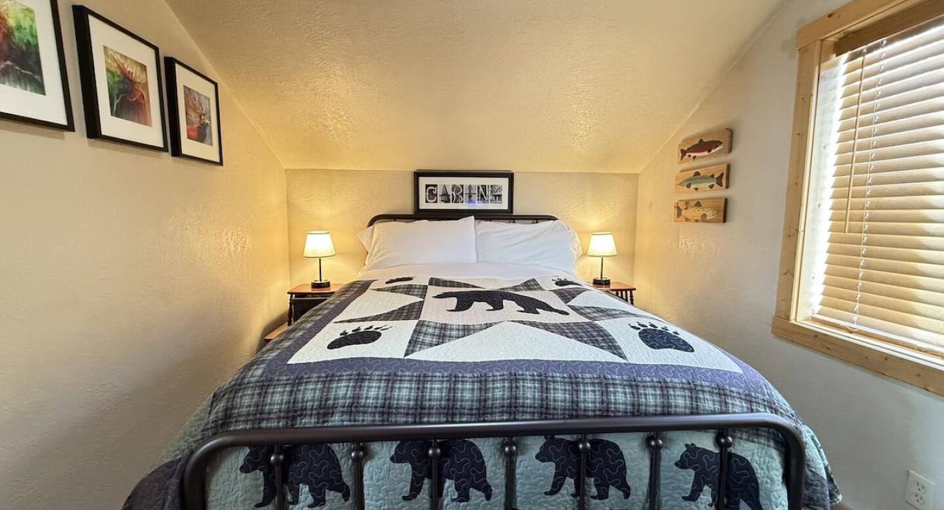 Upstairs bedroom with a queen bed.