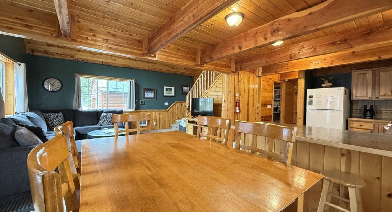 Dining area with plenty of seating. Comfortably seats 6 at the table and 2 at the bar.