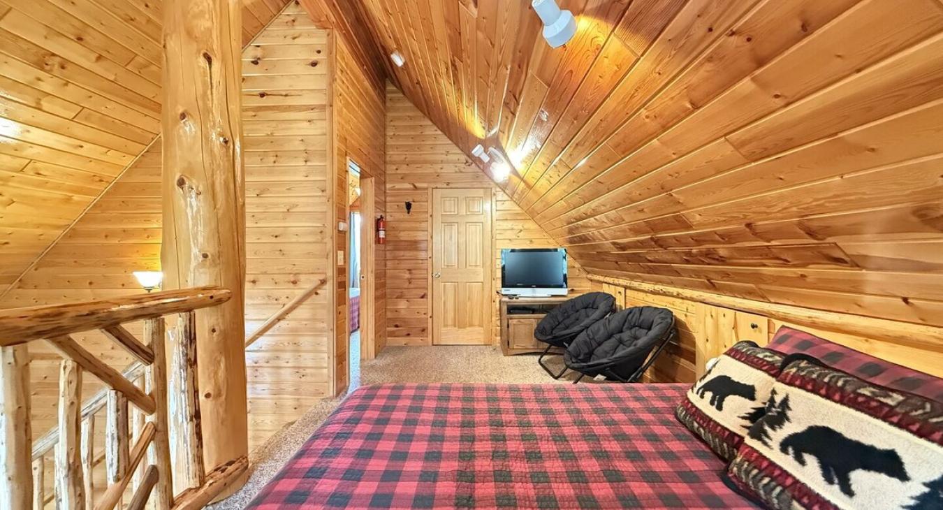 Upstairs loft with 2 queen beds to comfortably sleep 4 people.