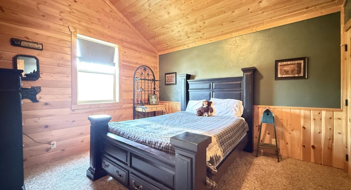 A double bed is located in the first bedroom upstairs.