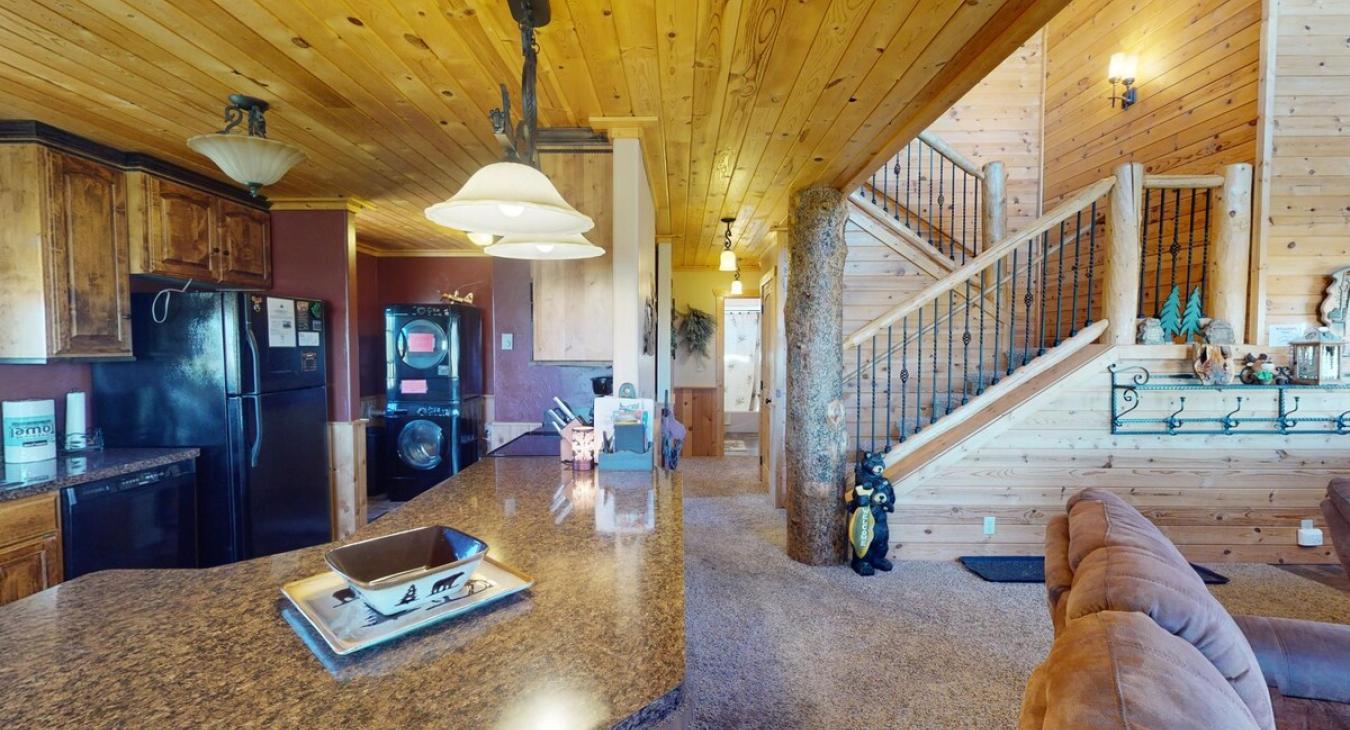A large kitchen island with a view of the kitchen.