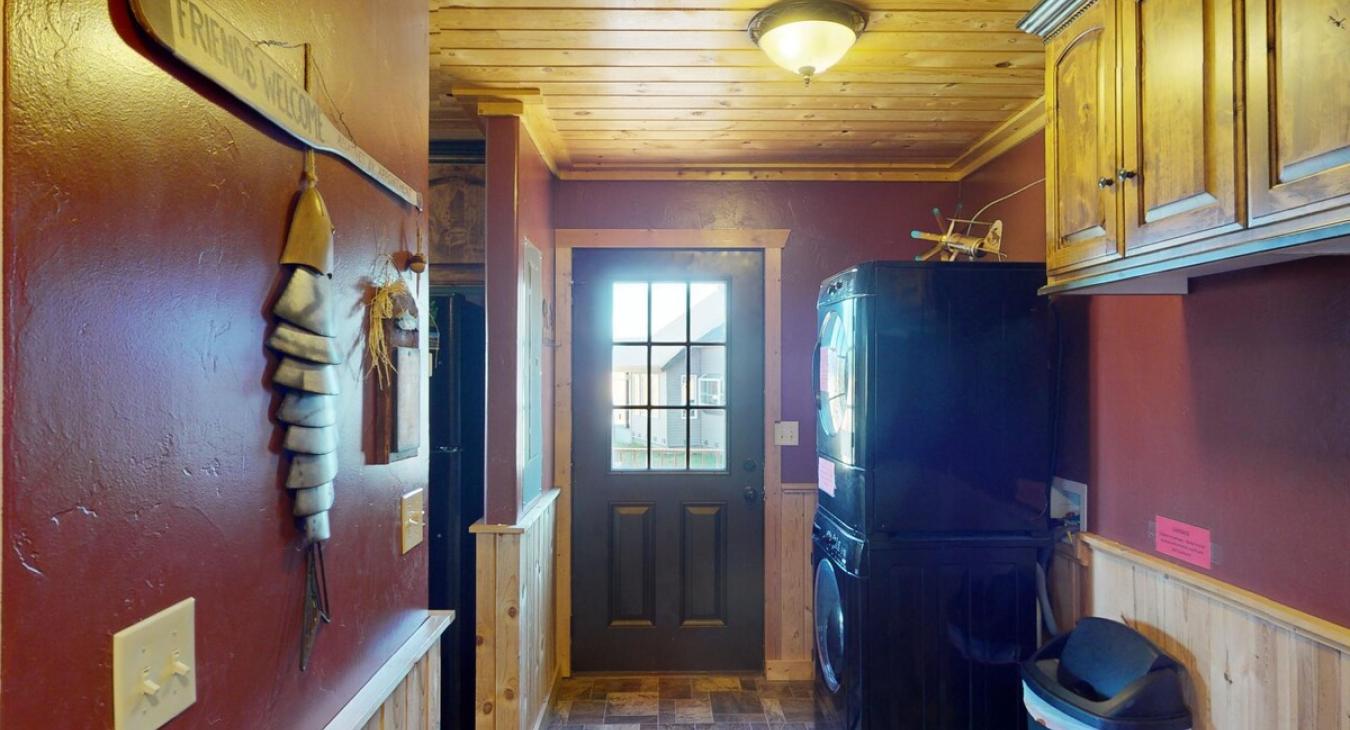 There is a stacked washer and dryer access to the back deck.