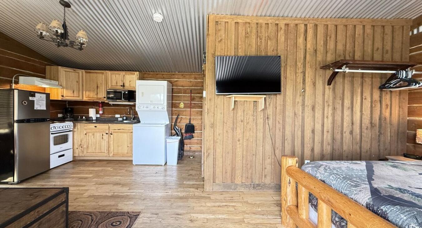 Open living room that flows into the kitchen for easy communication.