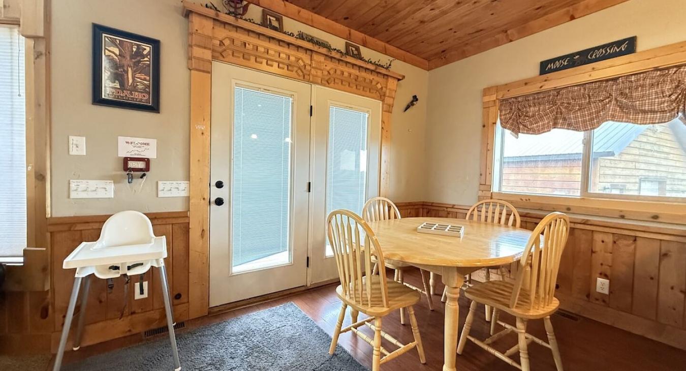 Beautiful open entrance to the cabin to the first dining table with seating for 4.
