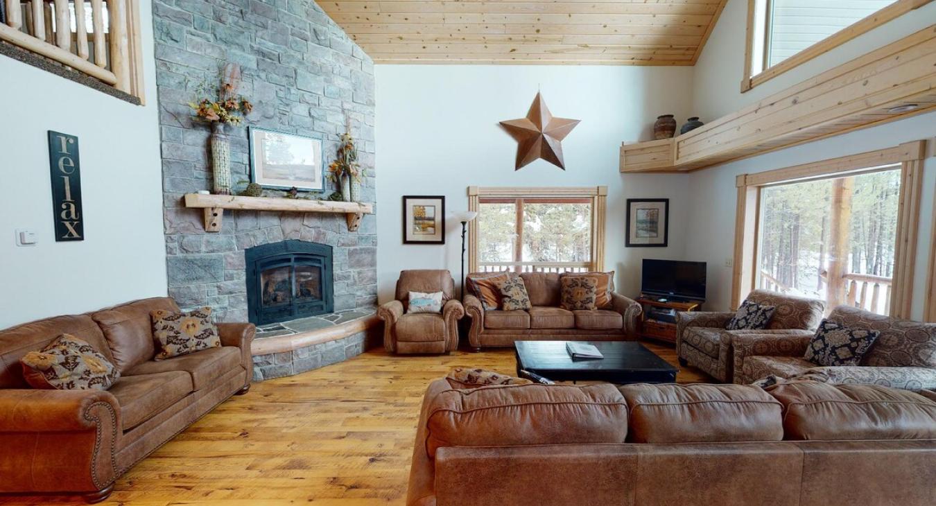 Sofas and fireplace in the living area. Perfect for relaxing after a long day outdoors.