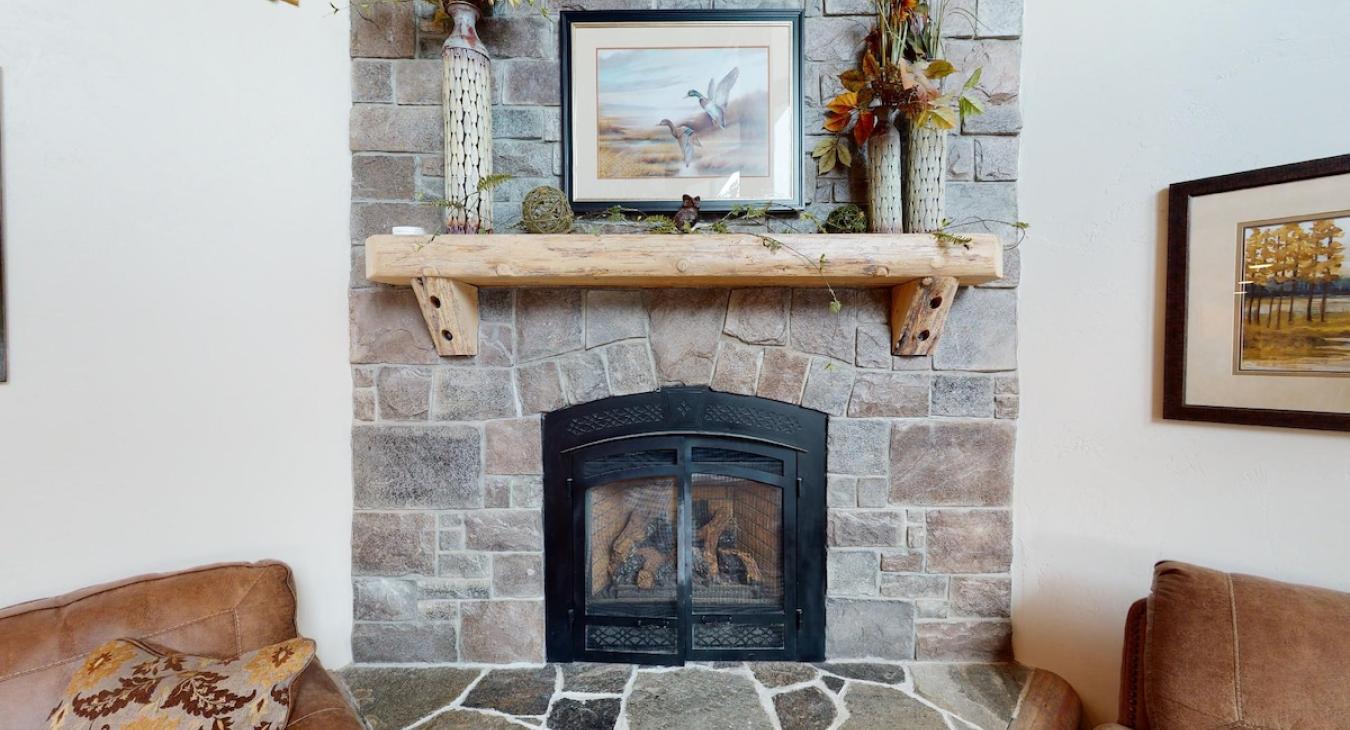 Propane fireplace in the living room, cozy up and read a book on a cool evening.