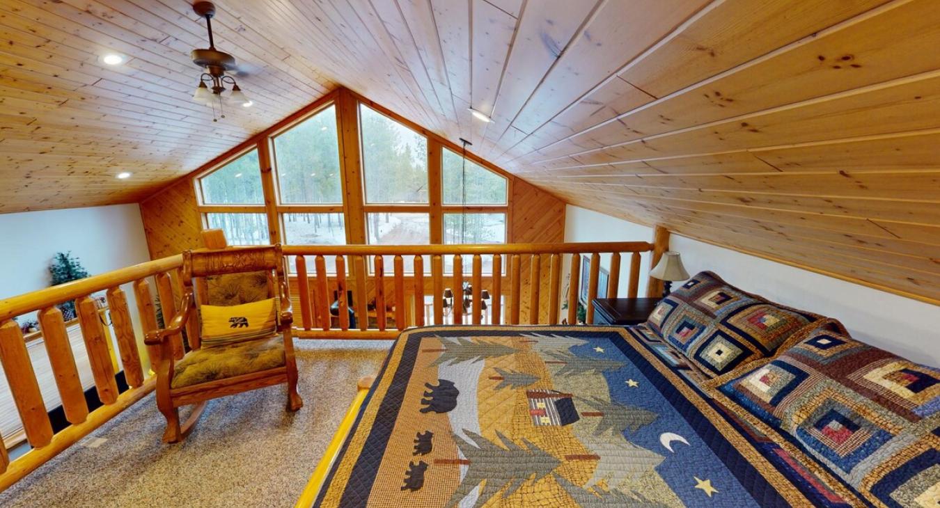 Upstairs loft with a Queen size bed.