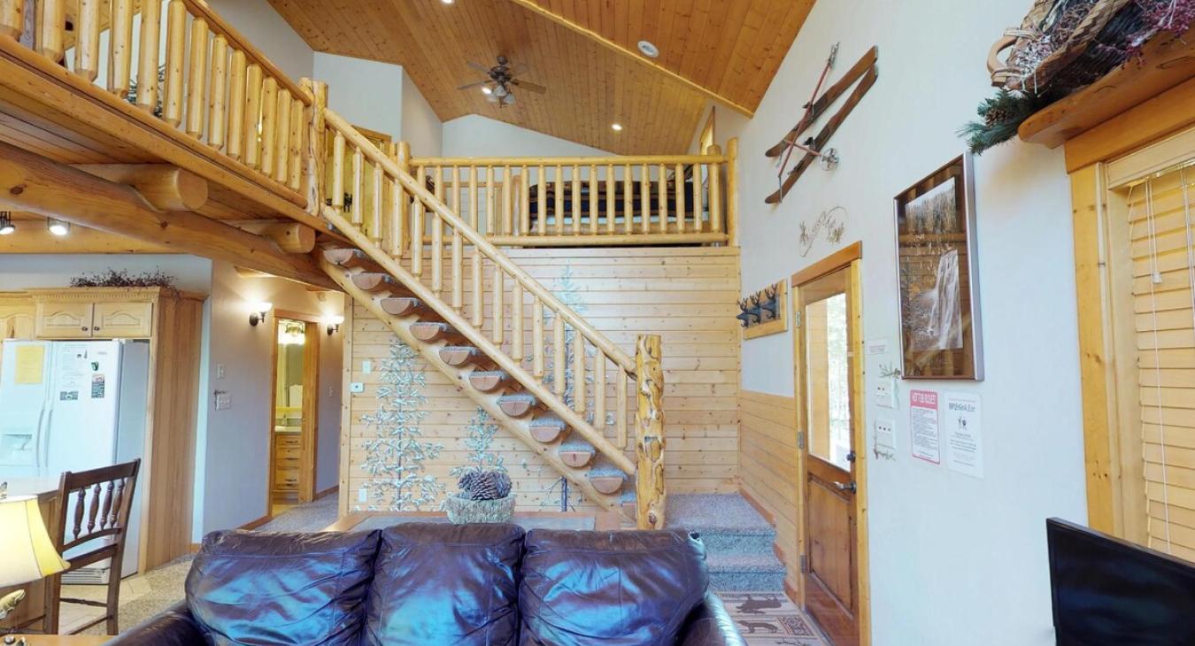 Access to the loft, upstairs bedroom, and bathroom are accessible through the stairs pictured here.