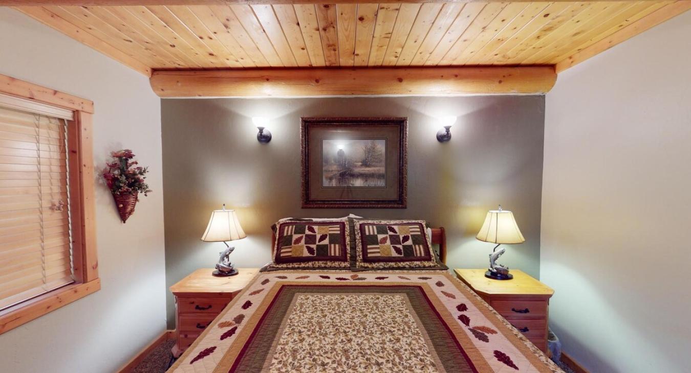 Picture a cozy bedroom in a cabin, where natural materials and soft lighting create a peaceful, retreat-like vibe.