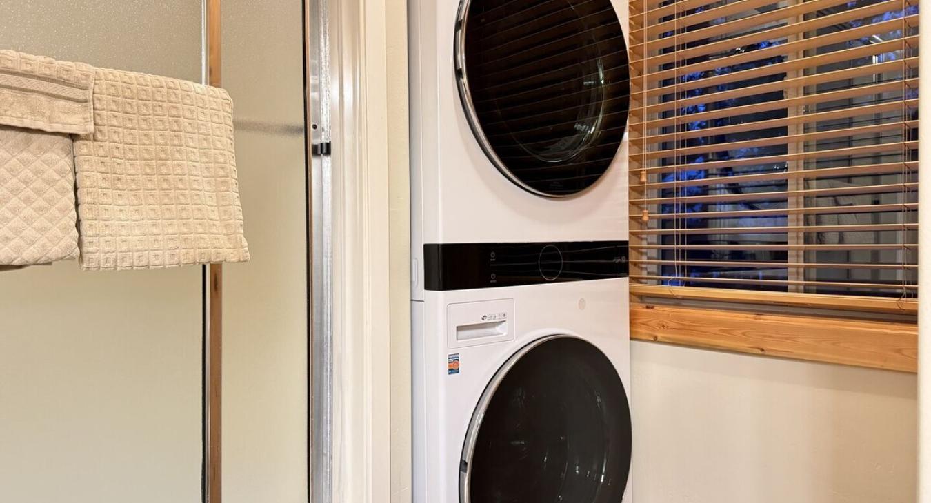 This bathroom also has a stacked washer and dryer for you to use. Laundry soap is also provided.