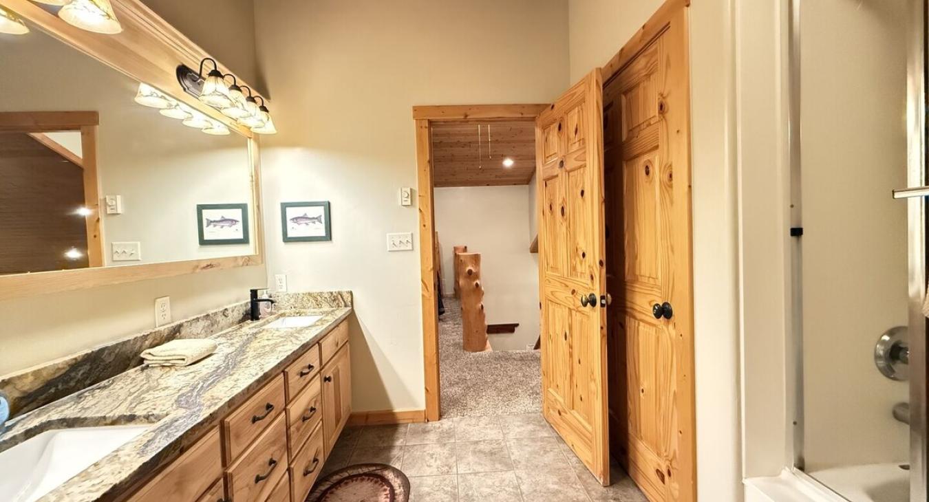 The bathroom where rustic charm meets spa-like comfort.