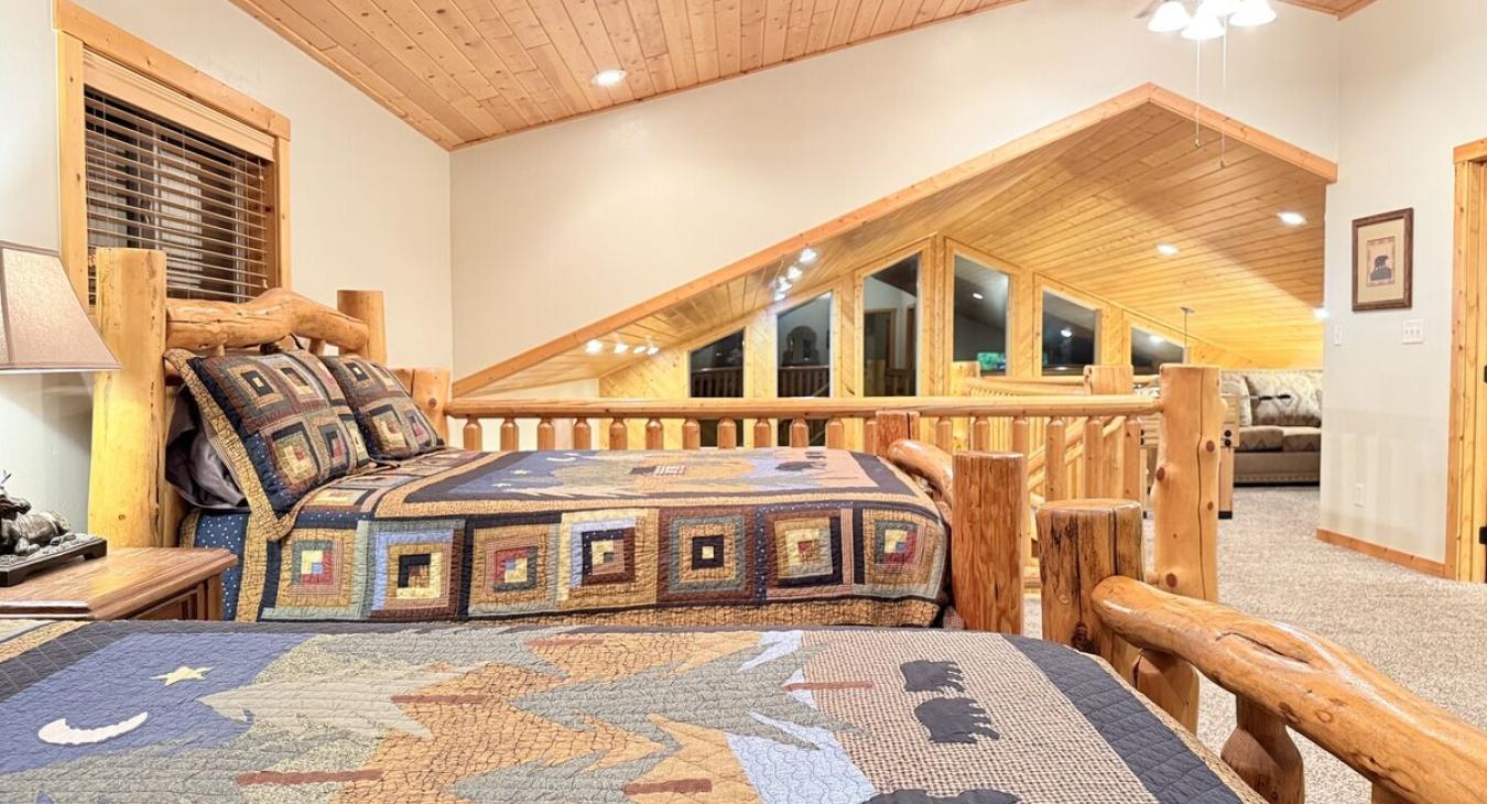 2 Queen size beds are located in the loft to sleep more guests.
