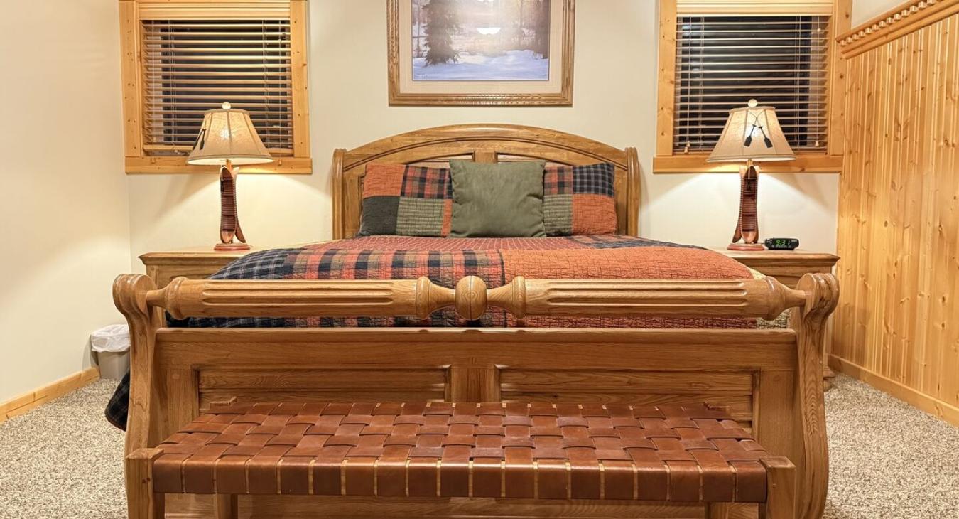 Bedroom #5 located on the main level with a Queen size bed.