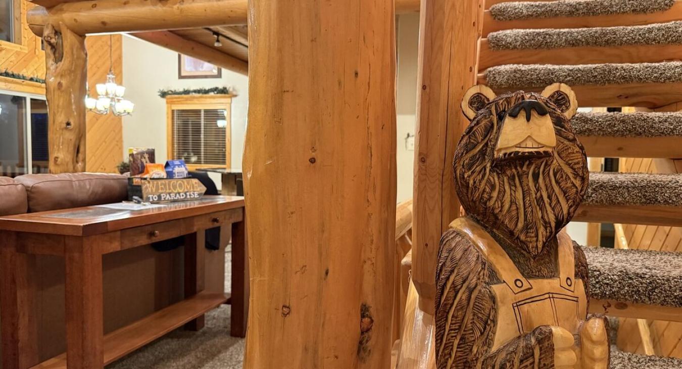Alright, let's head upstairs—you're in a loft tucked under a pitched cabin roof, and it’s got that perfect blend of chill and fun.