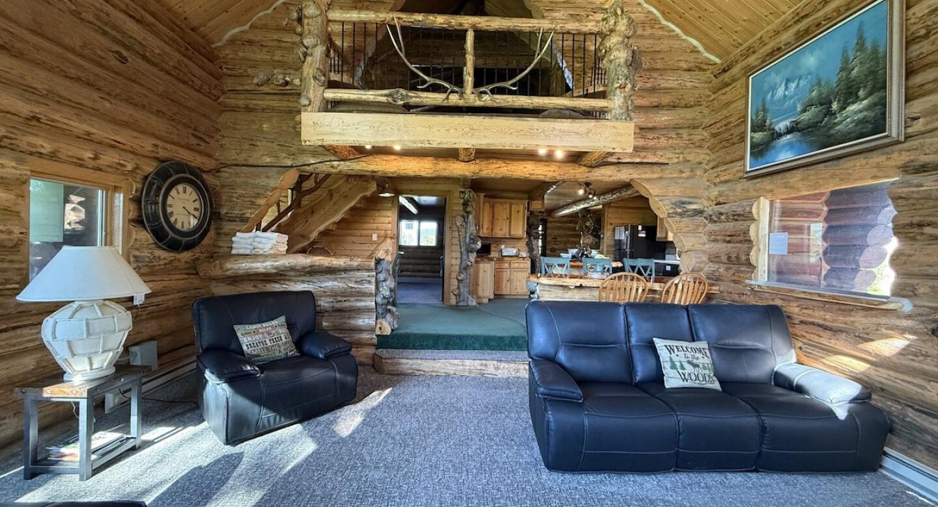 From the living room you can view the upstairs loft, kitchen, and master bedroom.