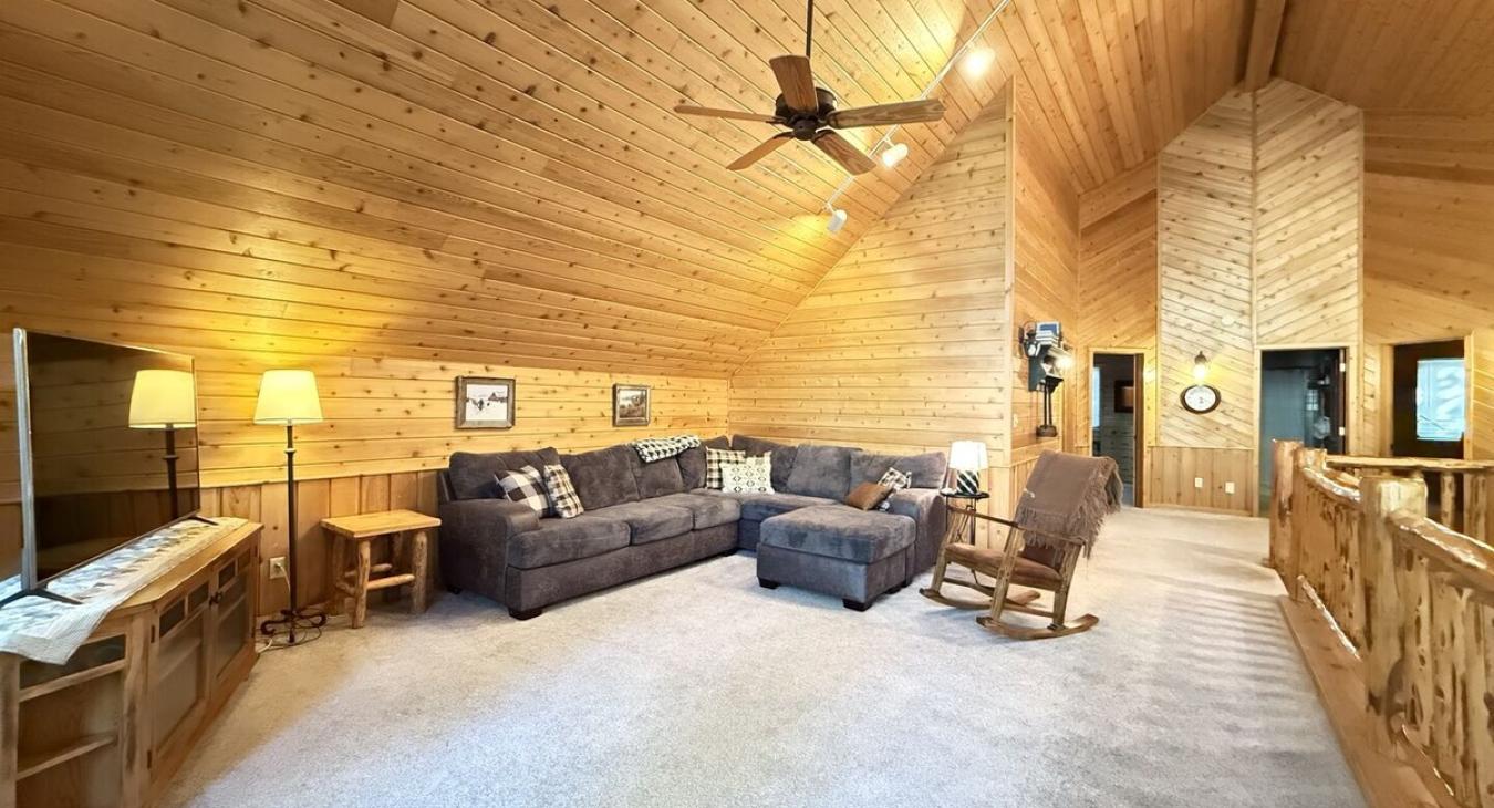 Upstairs loft with full couch and tv for you to enjoy.
