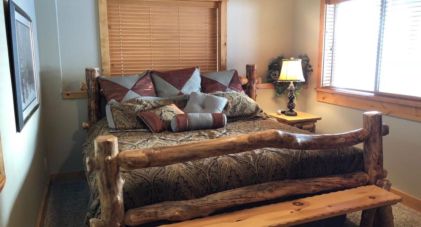 Basement Master bedroom with a King size bed.