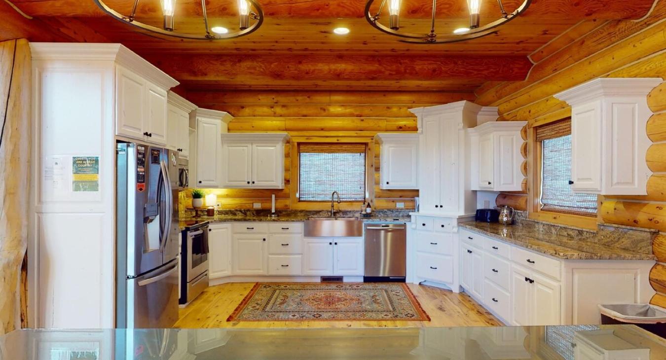 Beautiful full size kitchen that includes basic appliances, spices, pots and pans.