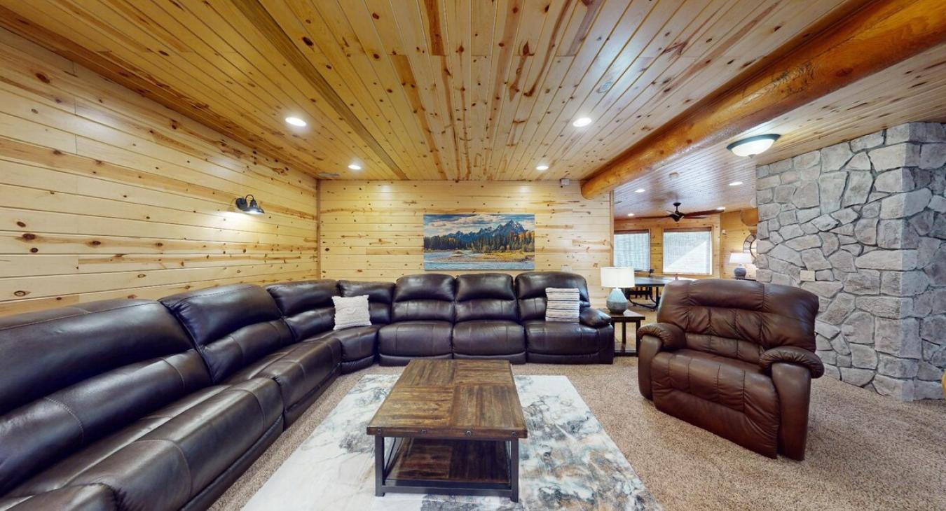 The couch is big enough to seat several people, with soft cushions and throws that add to the relaxed atmosphere.