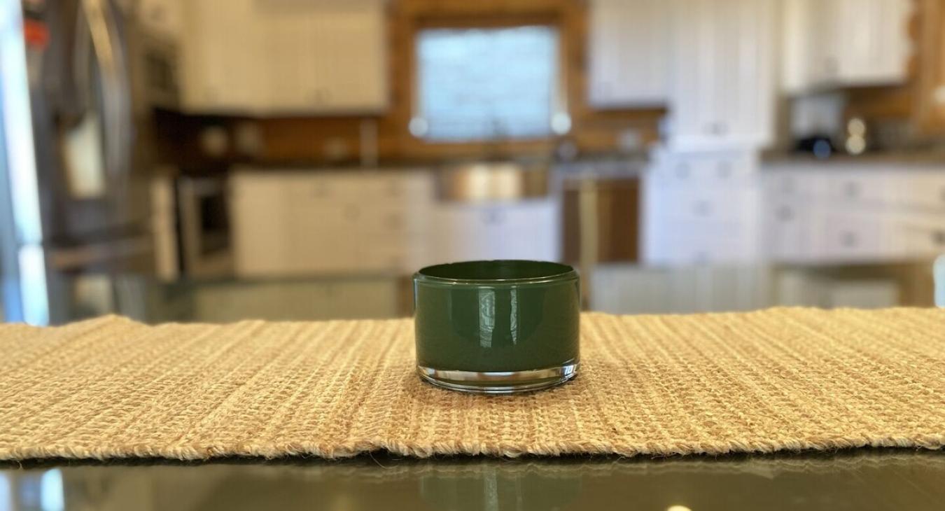 Imagine a cozy kitchen in a cabin, where the soft flicker of a candle adds a touch of warmth and intimacy to the rustic space.