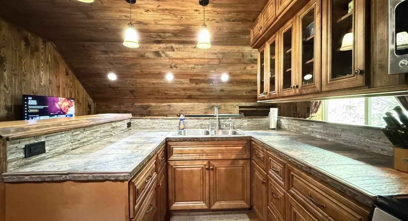 In the kitchen there is cabinets with kitchen appliances, dishes, and basic necessities you need to cook during your stay.