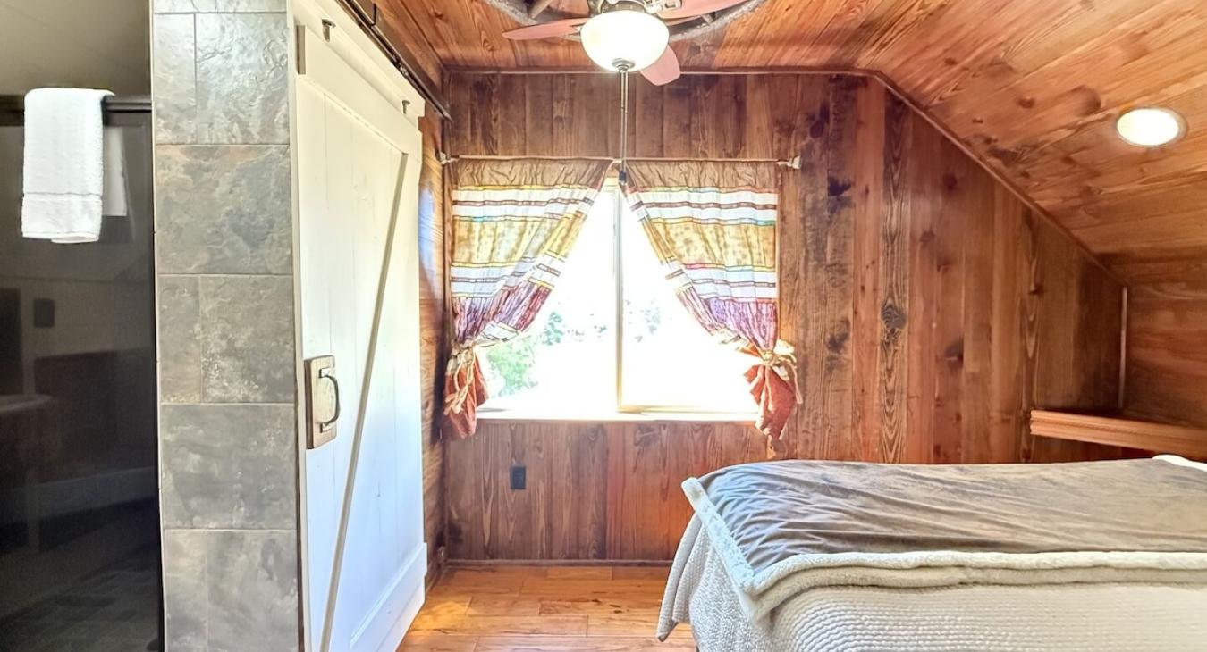 The master bedroom is equipped with a queen bed and ensuite bathroom.