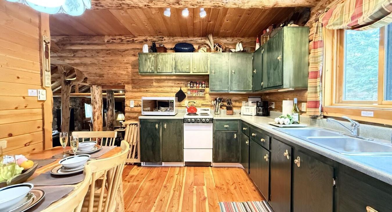 The kitchen is located adjacent to the living room.