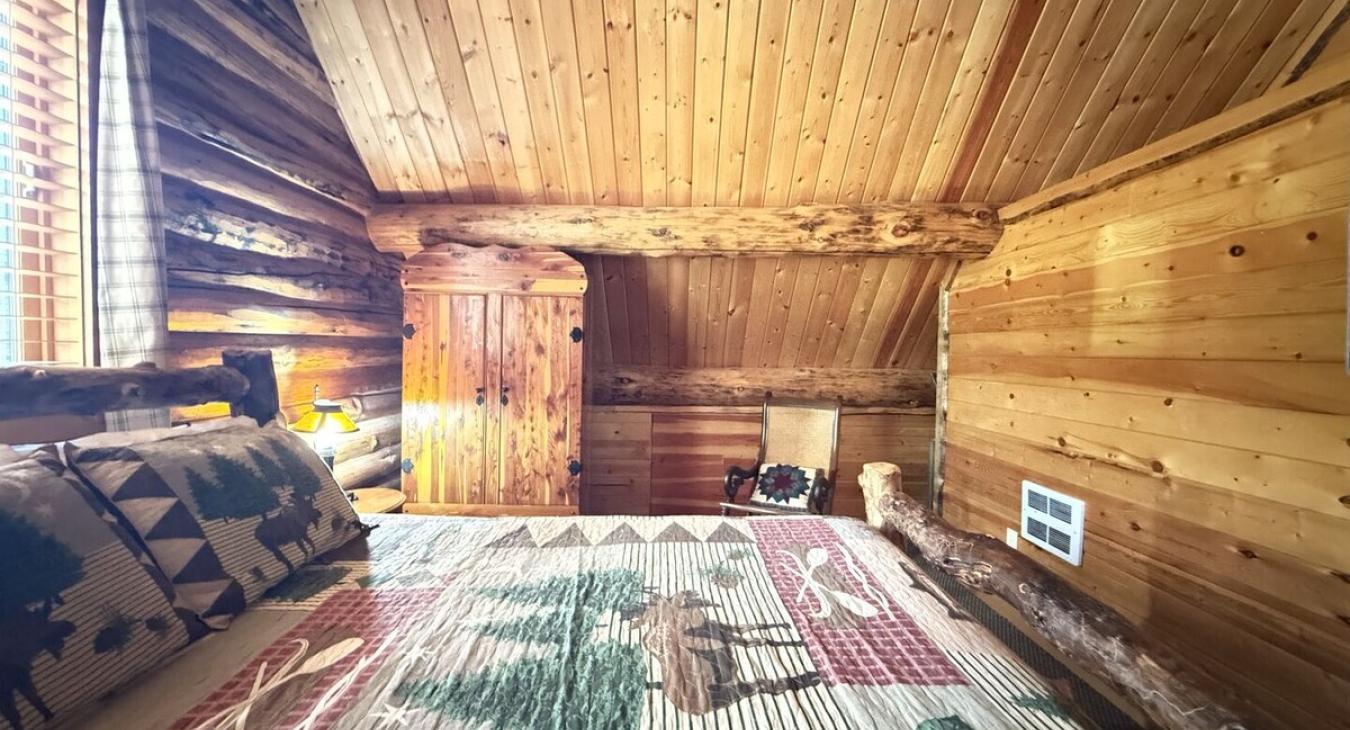 Bedroom #3 located upstairs with a Full and Twin bed.
