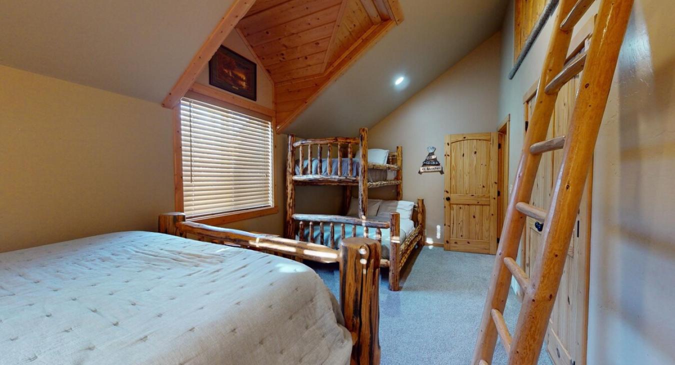 Large window in the middle of the room that lets in natural light in during the day.
