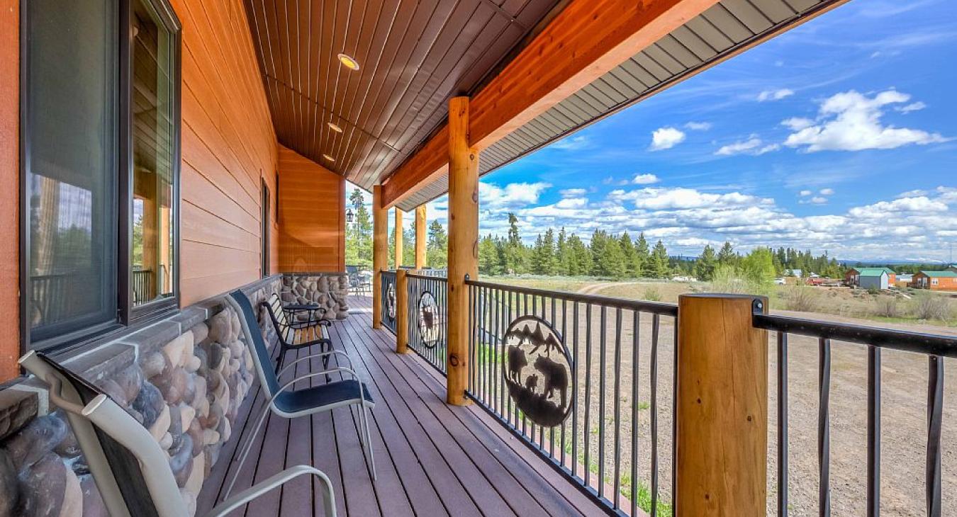 Front Deck with seating and view of the landscape beyond.
