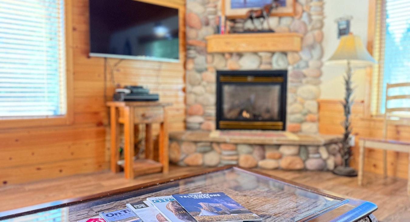 Natural light pours in through large windows, tying it all together with a view of the forest just beyond.