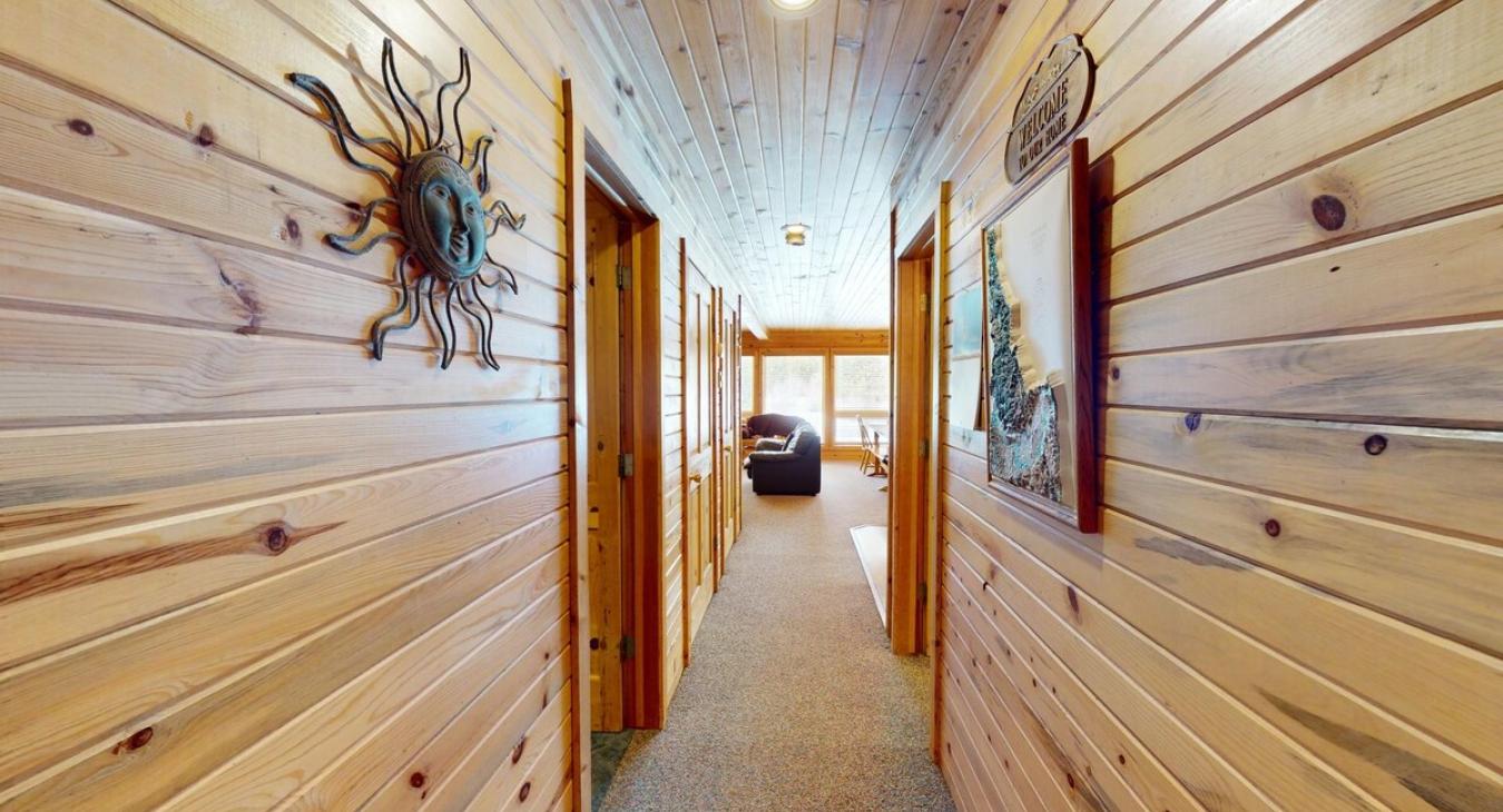 Hallway to access all the rooms and make your way to the upper level.