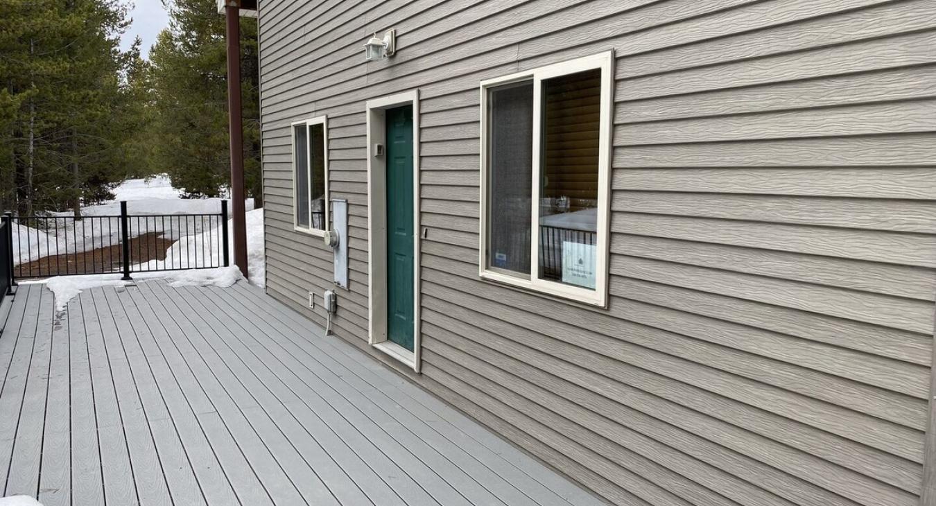 Outdoor deck with the entrance door.