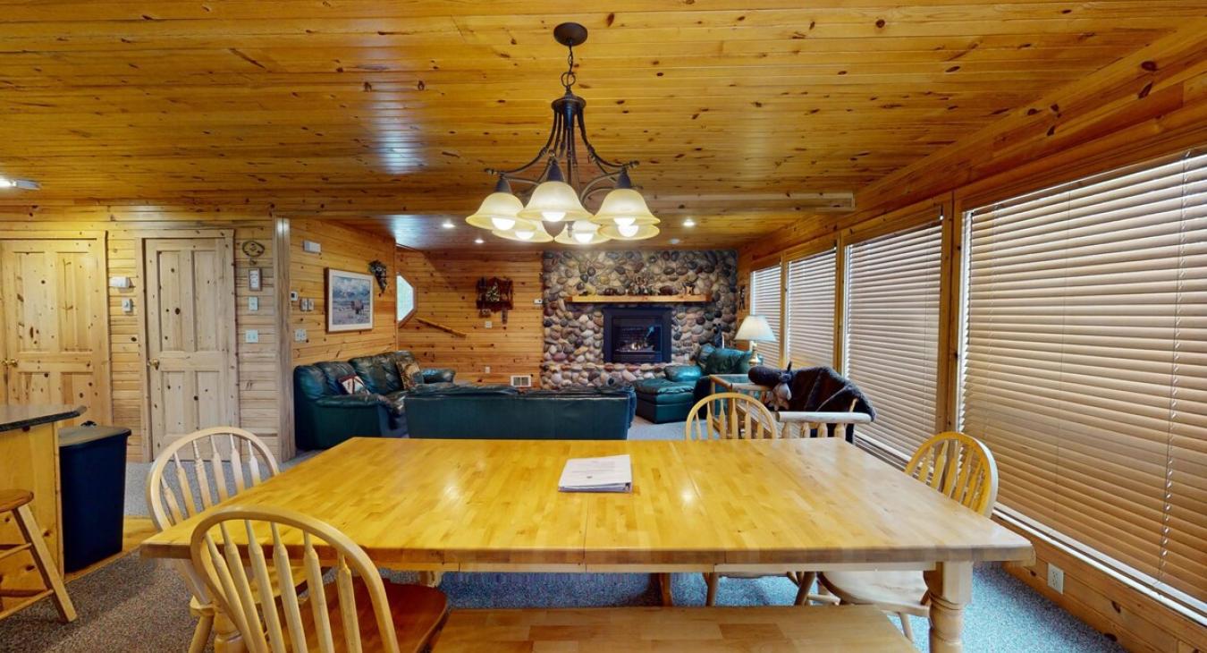 Dining area that seats up to 8 people with additional bar stools at the kitchen island.