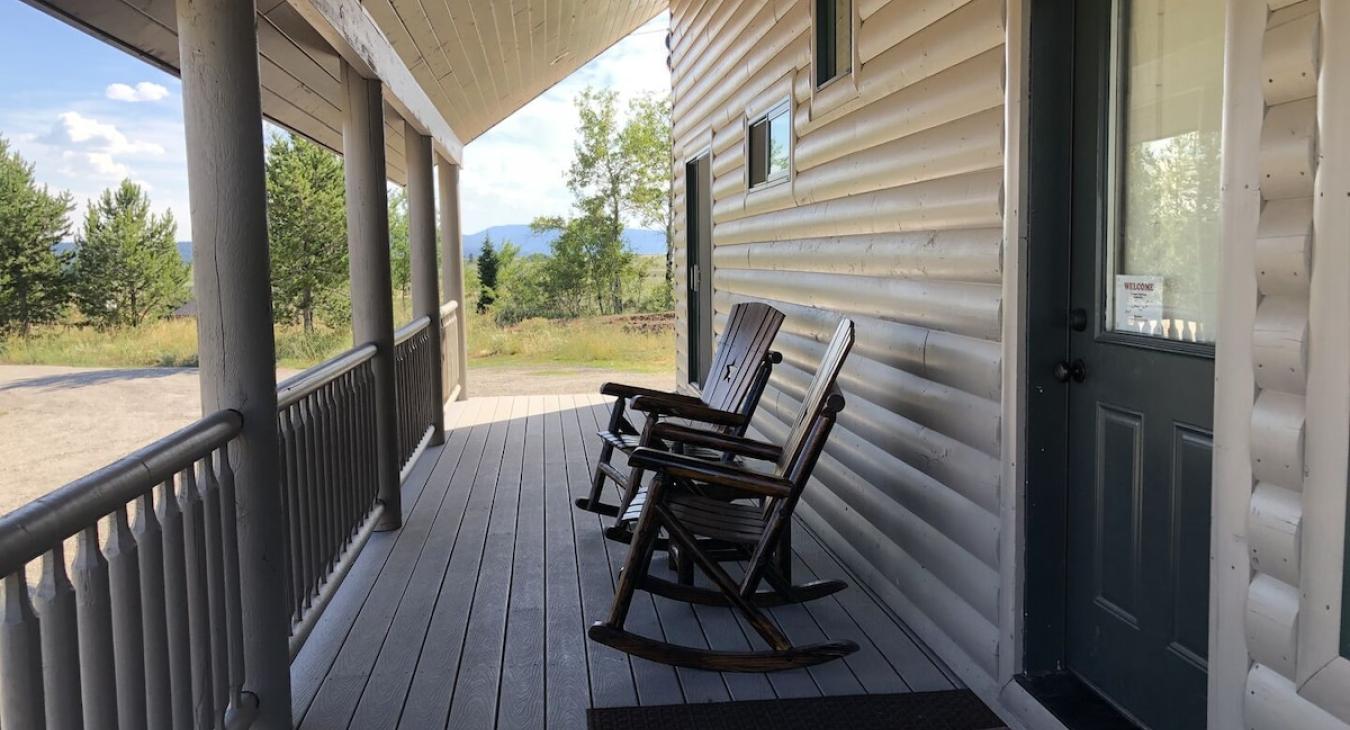 Patio with seating to enjoy the beautiful landscapes of the cabin.