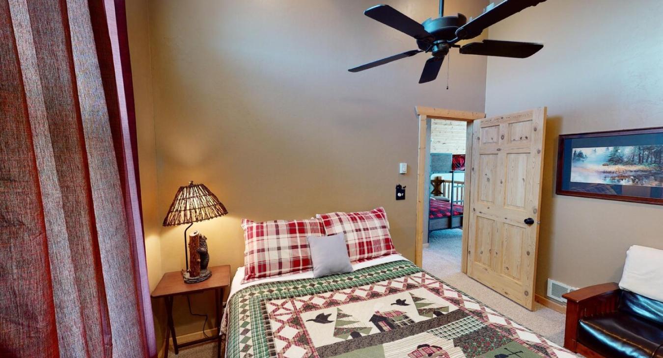 Large open bedroom that brings in lots of natural light.