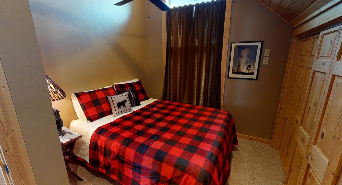 Bedroom #2 located upstairs with a Queen size bed.