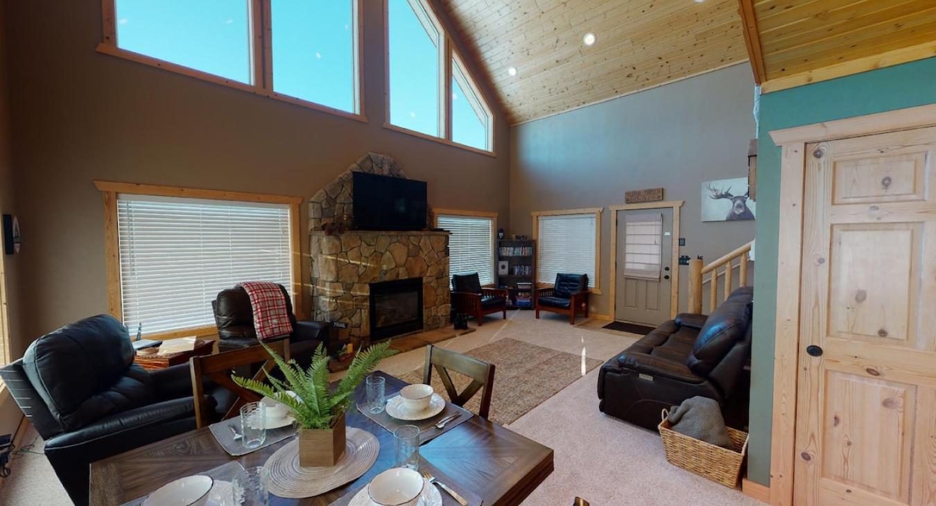 Dining room table is adjacent to the living room and kitchen. Perfect for up to 4 people.