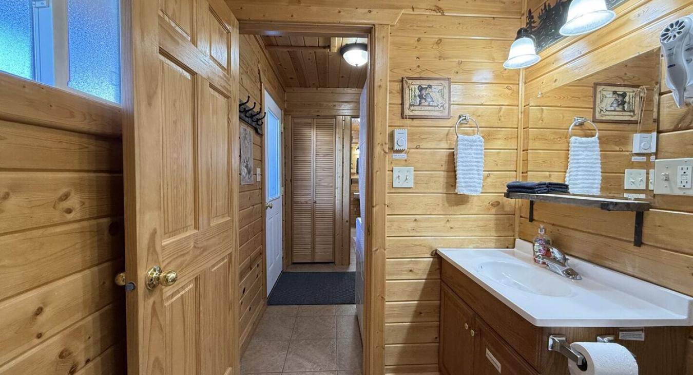 A cabin bathroom feels like a little retreat within a retreat—warm, earthy, and connected to nature in the most calming way.