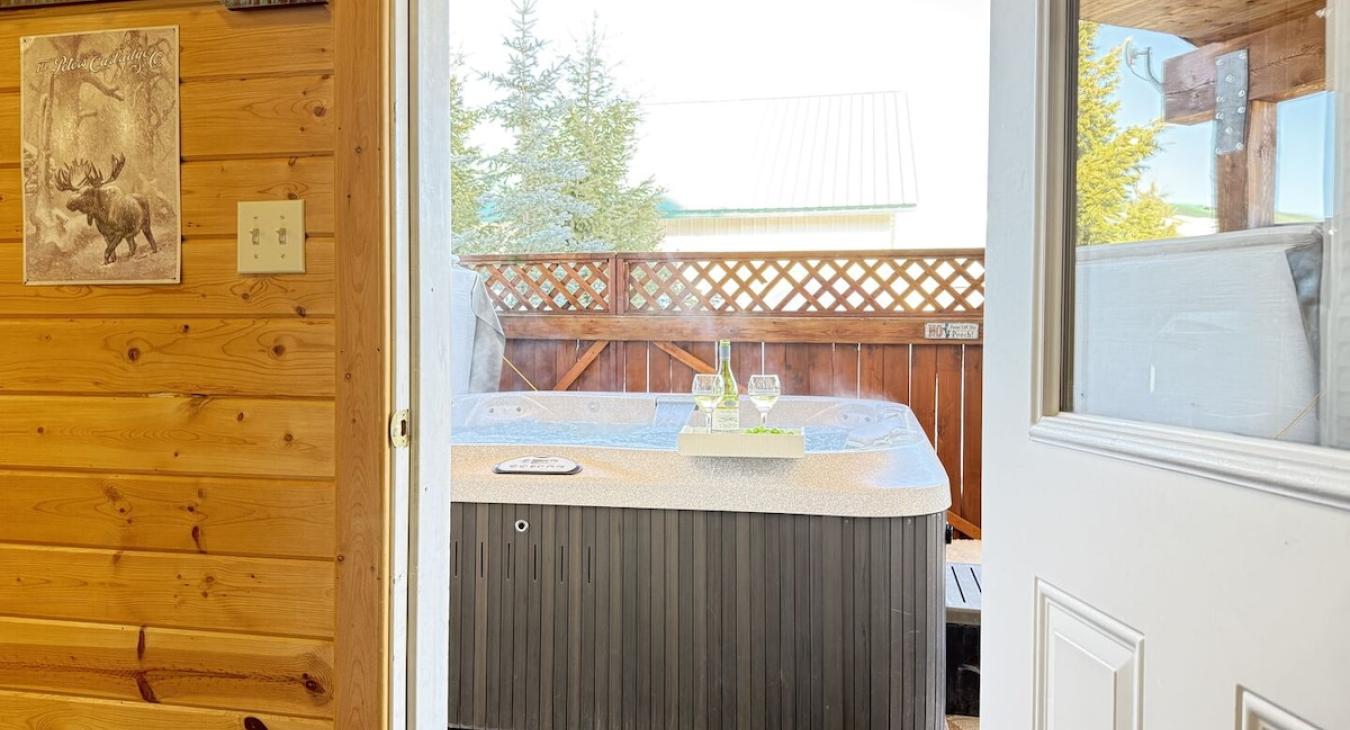 Walk out back to enjoy the hot tub available year round.